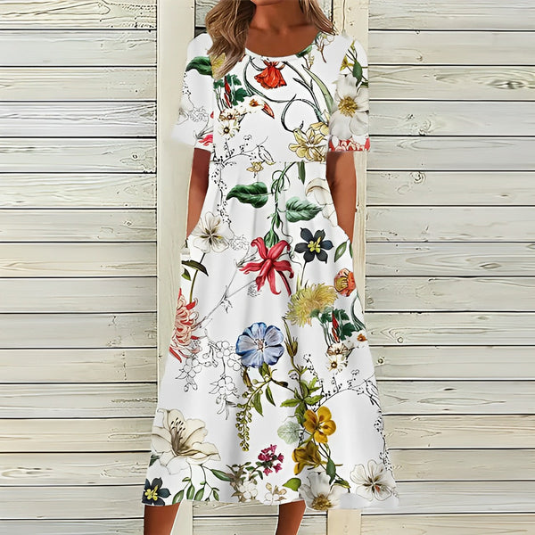 Bloemige zomerjurk - witte damesjurk met een levendig bloemenpatroon
