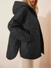Gewatteerde puffer zwarte en beige winterjas voor dames - warm en oversized - Bakkermode.nl