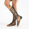 Goud en zwarte sandalen met dubbele gespen - Bakkermode.nl