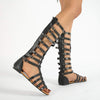 Goud en zwarte sandalen met dubbele gespen - Bakkermode.nl