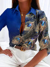 Dames blouse met pauwenveerprint - elegante geprinte top