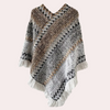 Gebreide poncho - stijlvolle dameswrap met franjes