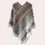 Gebreide poncho - stijlvolle dameswrap met franjes