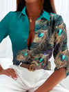 Dames blouse met pauwenveerprint - elegante geprinte top