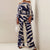 2-delige satijnen set - elegante off-shoulder top en wijde pantalon