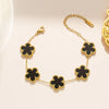 Luxe armband - elegante gouden damesarmband met zwart bloemenmotief - Bakkermode.nl