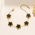 Luxe armband - elegante gouden damesarmband met zwart bloemenmotief - Bakkermode.nl