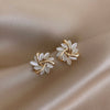 2-delig gouden bloemenoorbellen - elegante dames sieradenset
