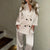2-delige dames lounge set in hedendaags wit - top en broek van een zijdeachtige mix